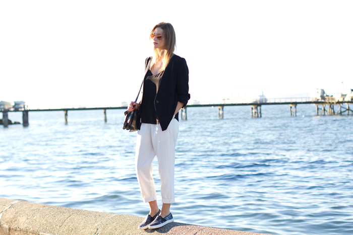 Vancouver Fashion Blogger, Alison Hutchinson, is wearing Front Row Shop white linen trousers, Zara black blazer, Aritzia black silk camisole, Vince slide-ons, Botkier silver bag