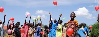 Happiness is a red balloon in Rwanda Africa.
