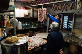 Buying fresh made sausages in Tuscany, Italy