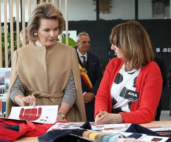 Queen Mathilde visited J and JOY in Waremme which is a clothing brand that is also socially and philanthropically active. Natan dress and camel cape