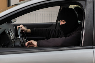 Car thief driving stolen car