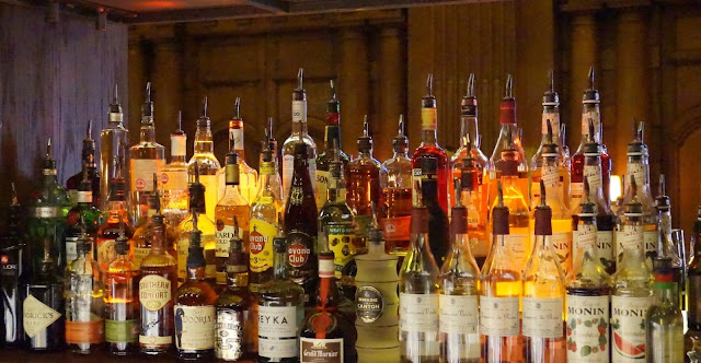Bar stocked with bottles of spirits