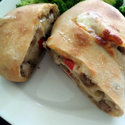 Cheese Steak Stromboli:  Shredded beef, peppers and onion rolled in a pizza dough with cheese and baked until crisp.