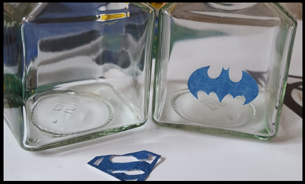 I used templates for the Superman and Batman logo as I'm no good a freehand - I leave that skill up to my partner (see his fabulously drawn TMNT head).  I printed the images and placed the tape over the images and cut them out.