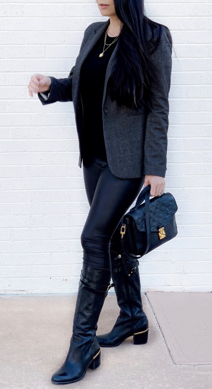 The perfect pair of Riding Boots with Gold Hardware Detail, paired with faux leather leggings, comfy top and chic plaid blazer www.MalenaHaas.com