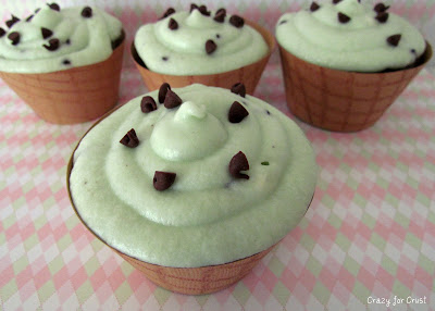 cupcakes with mint chip ice cream frosting in brown paper waffle cone wraps on patterned paper 