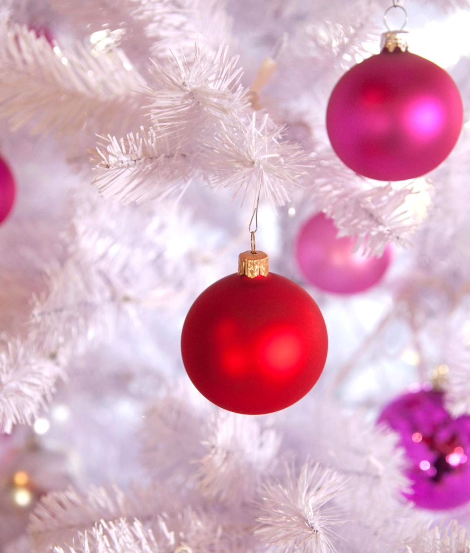 White Christmas Tree with Red and Pink Ornaments (via HGTV)