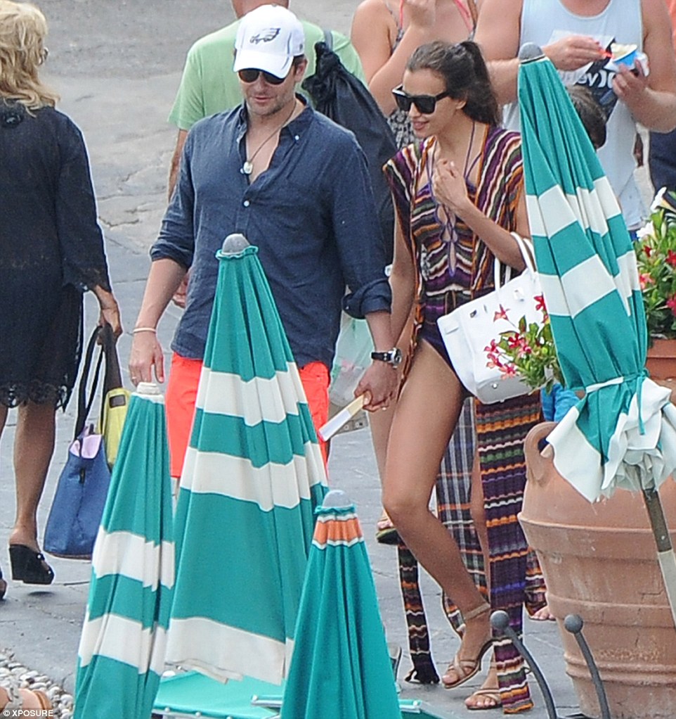 Irina Shayk plants a kiss on Bradley Cooper on PDApacked Italian getaway