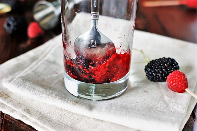 Muddling Berries in Cocktail Glass Image