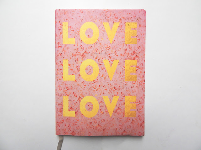 Pink notebook with roses on it cover reading LOVE LOVE LOVE in gold 