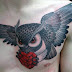 Owl tattoo on chest