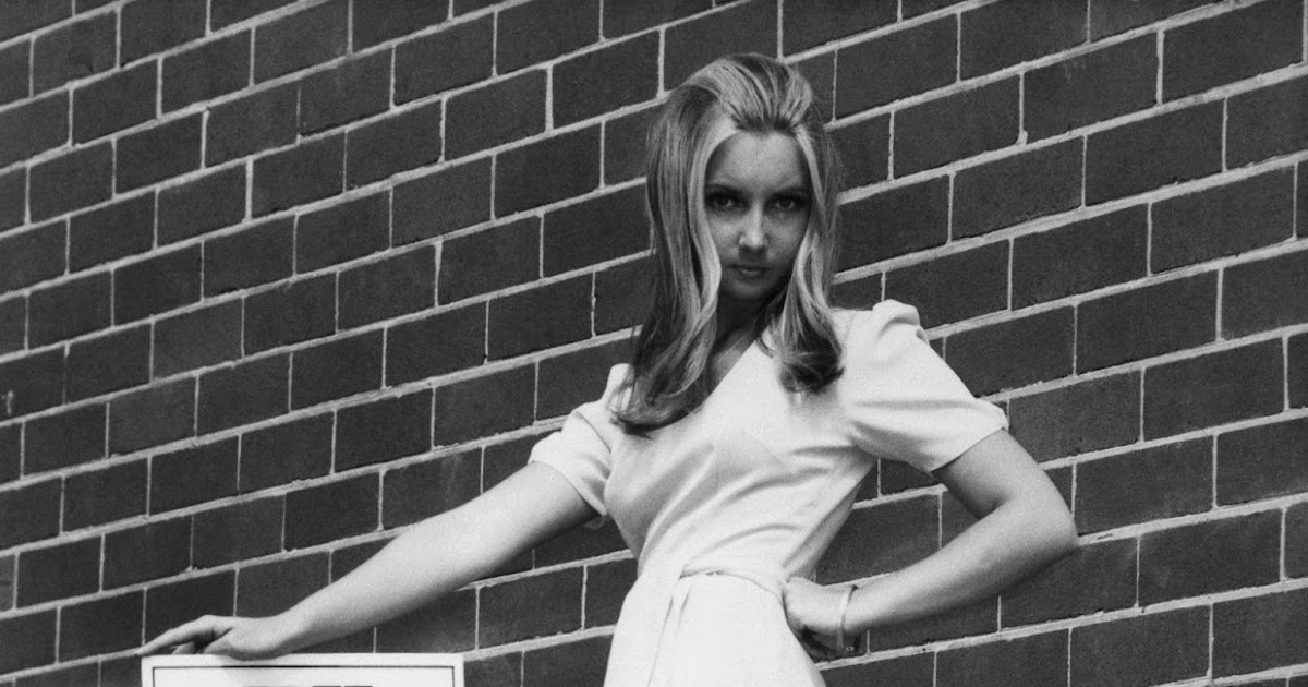 A fashion model poses with her sign for the 'Save The Mini' campaign sponsored by the Sydney