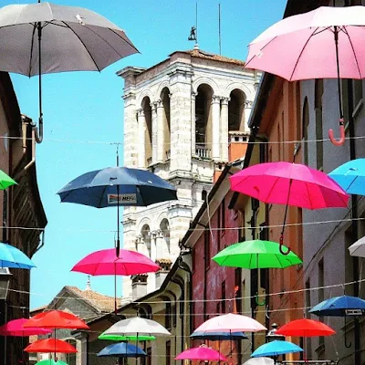 Things to do in Ferrara Italy. Seek shade under umbrellas