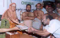 His Holiness launching the training division by handing over the plaque to K. Srinivasan