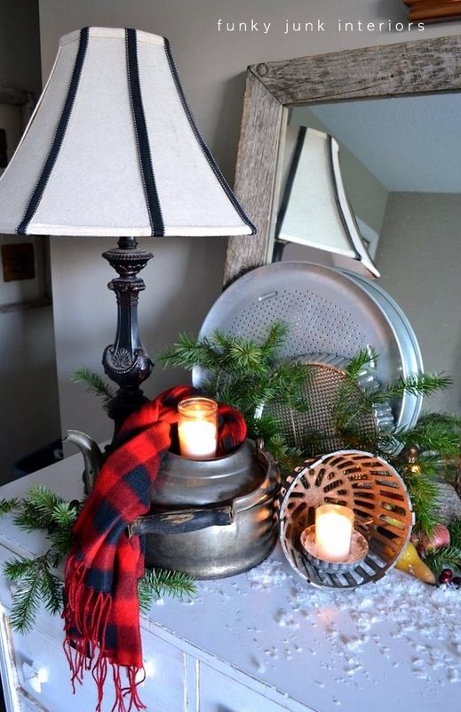 Old kettle and drain cover snow covered candle vignette - part of An all natural junk filled 2011 Christmas home tour, via https://www.funkyjunkinteriors.net/