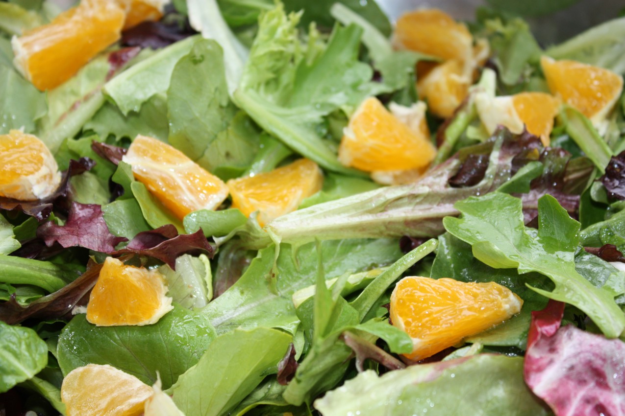 pass the peas, please mixed greens with orange juice vinaigrette