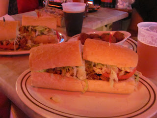 po' boys and craw puppies at ACME Oyster Co. in New Orleans, LA
