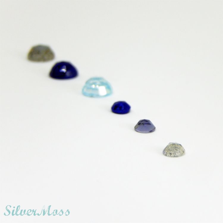 Rose Cut Cabochon Gemstones of Lapis lazuli, Labradorite, Iolite and Sky Blue Topaz in a line on SilverMoss Jewellery Rose Cut Cabochon Gemstones of Lapis lazuli, Labradorite, Iolite and Sky Blue Topaz in a line