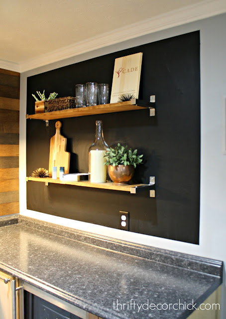 Chalkboard wall with shelving