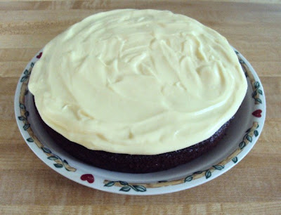Moist chocolate cake with a touch of banana, vanilla cream and fudge drizzle!