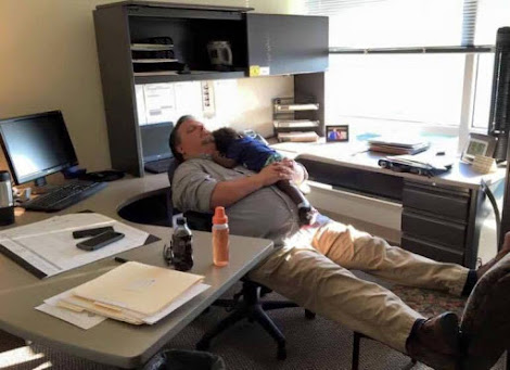 Man Falls Asleep In His Office Holding A Toddler This Photo Will