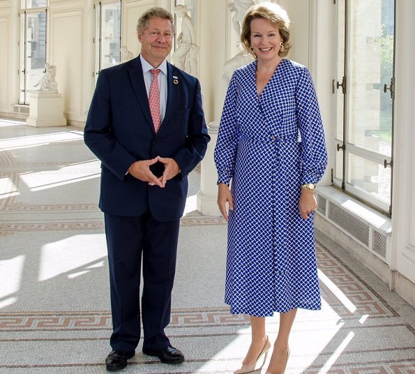 Queen Mathilde's outfit was by Dries Van Noten. European Commission President Jean Claude Juncker