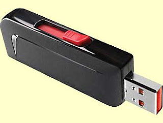 USB thumb drive, small black electronic item with silver plug on one end