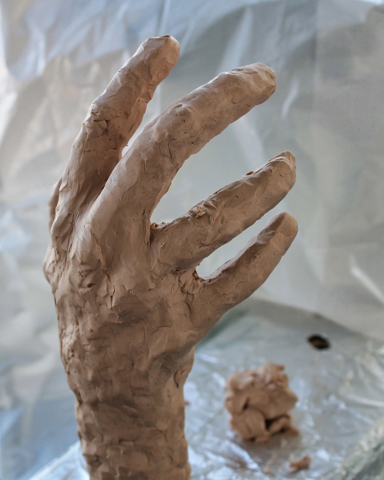 Connecting Pieces Sculpting a Hand out of Sculpy Clay The Wine Grab Sign