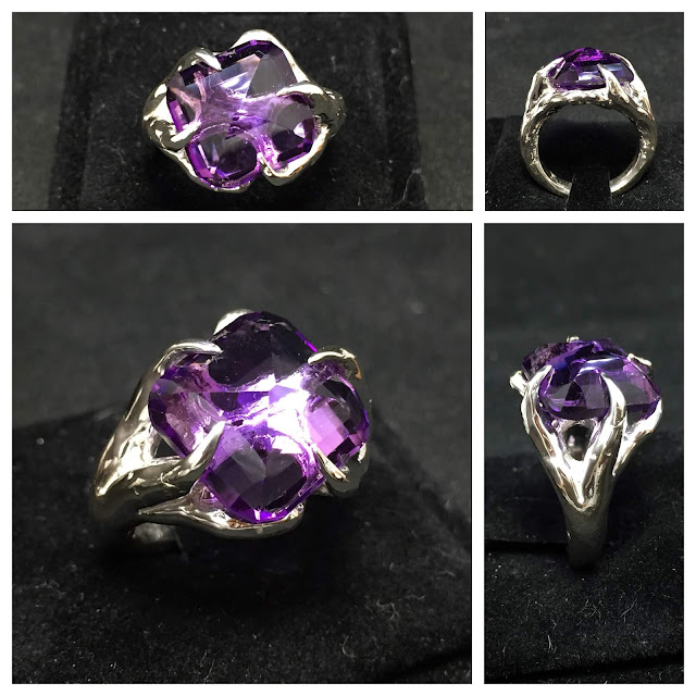 Anello artigianale in argento e ametista girata sottosopra taglio cushon, con griffes che ricordano elementi naturali. Artigiano Nero Craft.