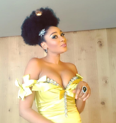 mbong amata exposes breasts