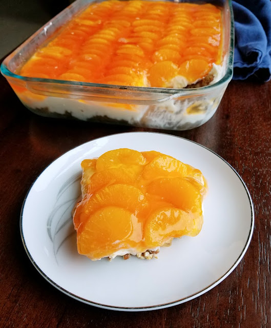 Salty pretzel crust, vanilla cream cheese center and a blast of orange on top, this orange creamsicle pretzel salad has it all. The only question is do you serve it as a side or a dessert? orange creamsicle pretzel salad served