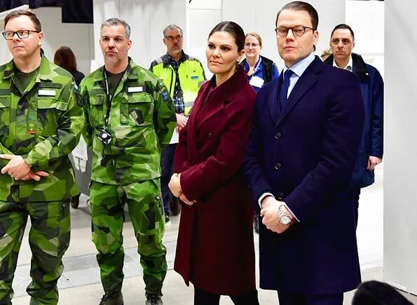 Crown Princess Victoria and Prince Daniel visited the military field hospital. burgundy wool cashmere coat