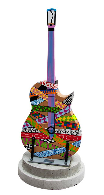 dowtown Orillia, outdoor art festival, painted guitars, multicolour abstract design