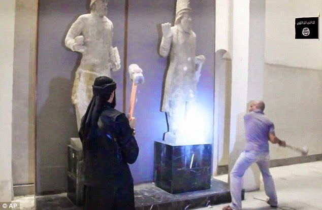 ISIS thugs take a hammer to civilisation Priceless 3,000-year-old artworks smashed to pieces in minutes as militants destroy Mosul museum