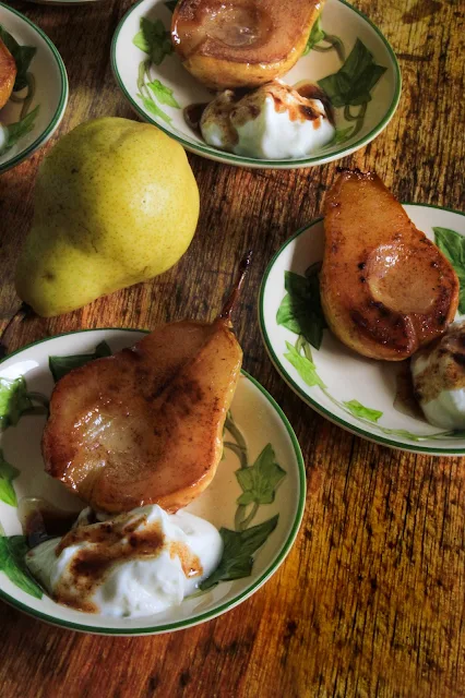 Roasted Cinnamon Buttery Pears, simple dish showcasing the straightforward flavor of pears.  They are buttery slightly sweet served as an accompaniment to pork, garnished in a winter salad, but also makes an elegant dessert for a fall dinner party, bridal brunch and quick weeknight snack.
