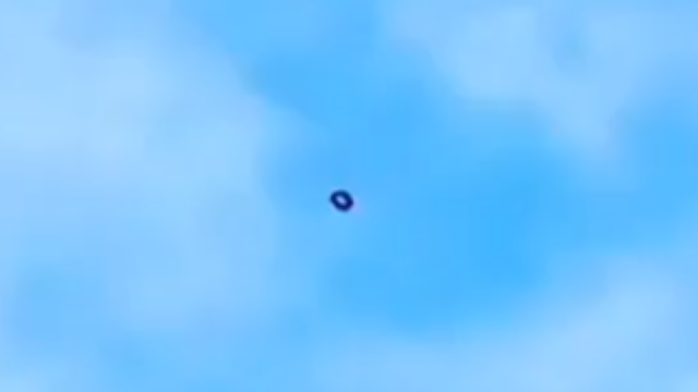 Black doughnut UFO right over Montreal in Canada.