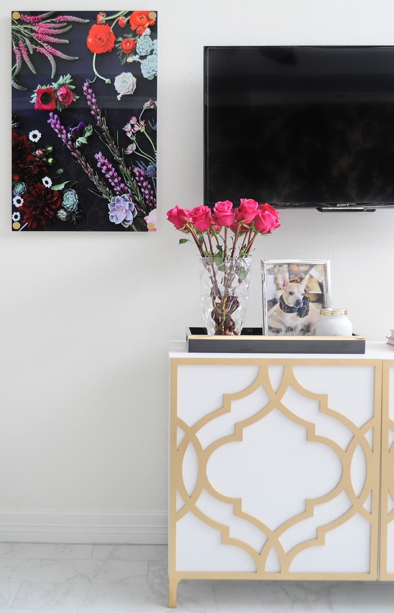 The Flora print from Jenny's Print Shop looks gorgeous flanking a TV in a master bedroom. Love this TV gallery wall idea.