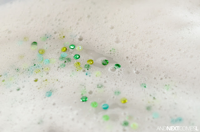 Add sequins to soap foam for a fun sensory bin idea for kids from And Next Comes L