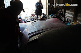 Mike shuffles in the darkened building that has housed his Corvette for 42 years.