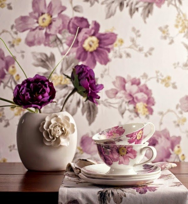 Wallpapers and fabrics with floral patterns as decoration in the interior design