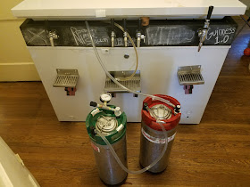 Jumping from the carbonating keg (right) to the serving keg (left).