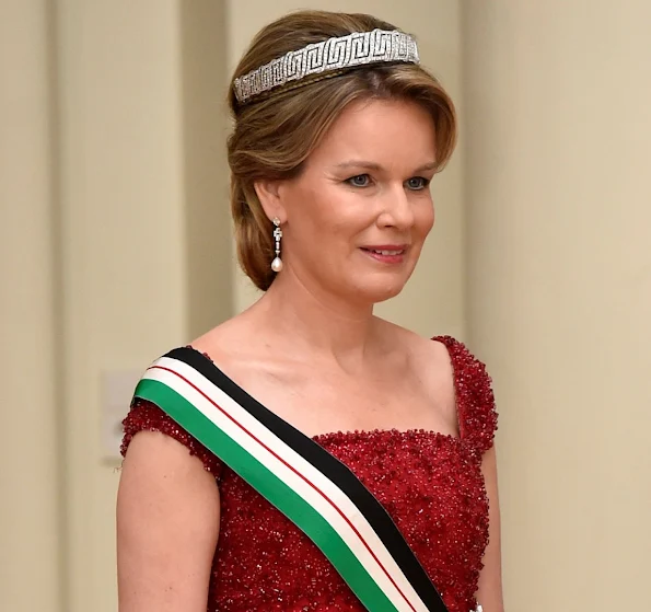 Queen Mathilde and Queen Rania attends a gala dinner at the Laeken royal Palace in Brussels. Queen Rania wore Valentino Gown, Queen Mathilde wore red gown. Queen Mathilde Tiara, Queen Rania diamond tiara