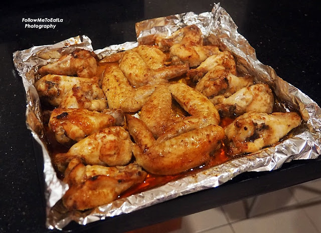 Bast the chicken wings with the leftover marinade when it has cooked for 15 minutes.