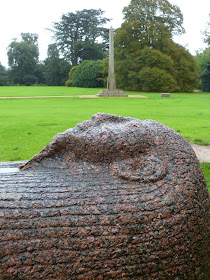 An Egyptian sarcophagus and the Philae obelisk  in the gardens of Kingston Lacy