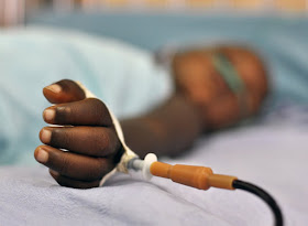 Patient in meningitis ward, pediatric hospital, Luanda, Angola