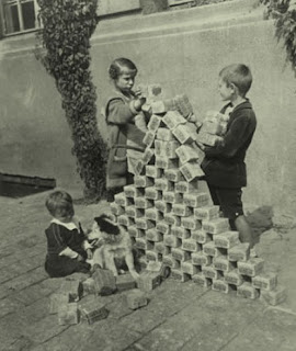 Children playing with stacks and stacks of devalued Deutschmarks during the early post war days