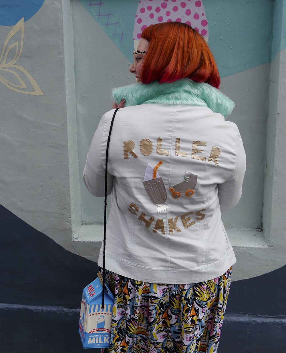 90s Style Customised Denim Jacket Styled by Helen, Wardrobe Conversations, Scottish Blogger, Edinburgh Blogger, Dundee Blogger, red head, ginger bob, Spex Pistols glasses, leopard print glasses, customised denim jacket, mint fur collar, Monki prints, Monki tshirt, Monki x Lynnie Zulu, Lynnie Zulu for Monki, River Island white lace up shoes, Rockcakes brooch, Rock Cakes pin badges, personalised denim jacket, Lucky Dip pins, milkshake with sprinkles, Roller Shakes, Blog Birthday, Style Diner, Kate George Mural Edinburgh, wall art Edinburgh, Edinburgh South side, Lou Taylor, tropical earrings, skinny dip london milk bag, novelty bag, milk bag