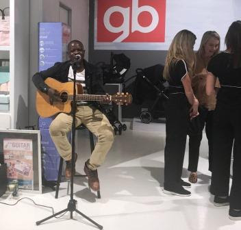 Mike Guitar Man playing guitar at Kids Living Launch Michael Baloyi Guitar Man guitar player and singing