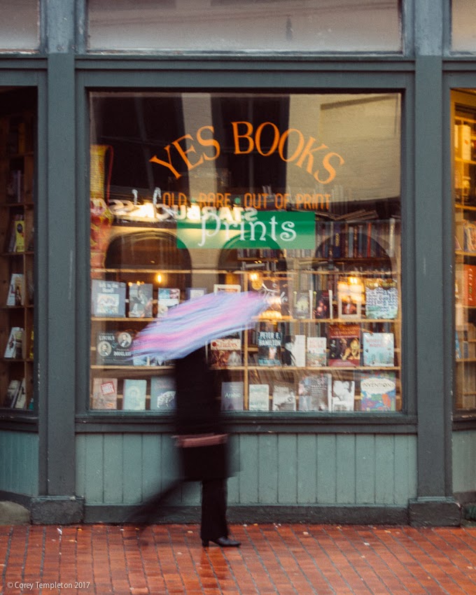 Portland, Maine USA April 2017 photo by Corey Templeton. Strolling by Yes Books in Congress Square on a rainy spring afternoon.