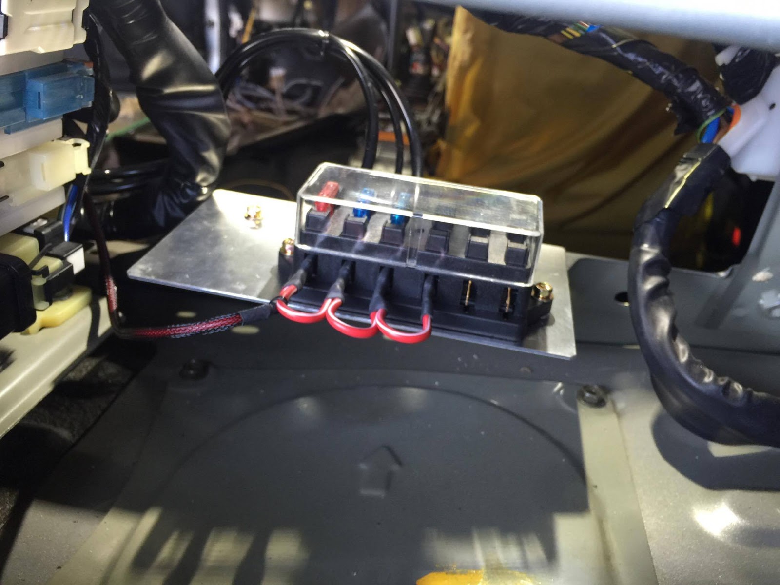 Custom fuse box for audio items in trunk by Nakamura. Nice, right? Except now that I've uncovered his errors, I'm worried about this.